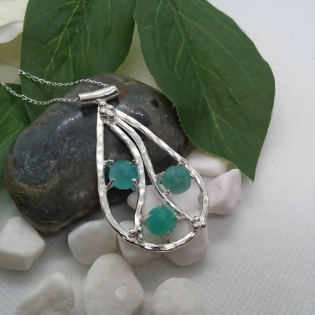 Sterling silver pendant with  Amazonite gemstones, with interesting wire design.