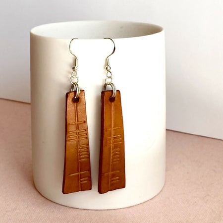 Ogham engraved tan leather dangle earrings | Irish-inspired jewellery