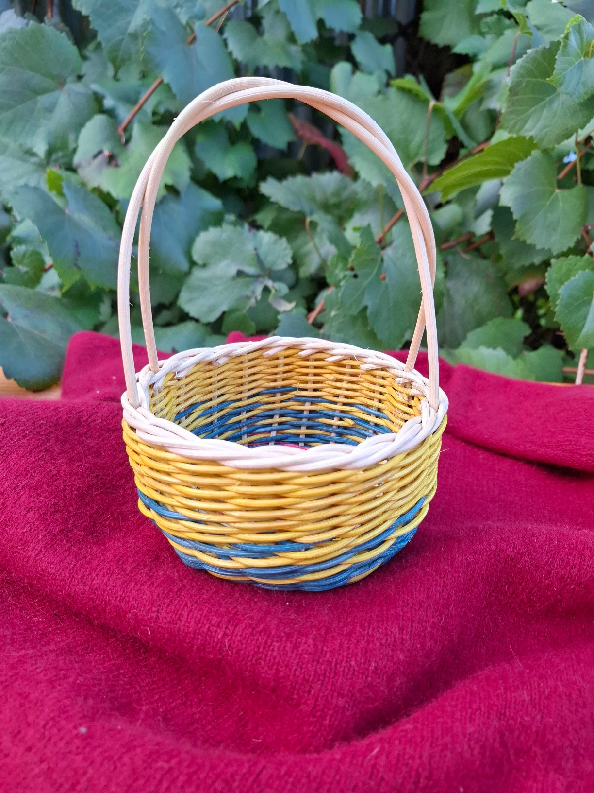 Small blue yellow handled basket