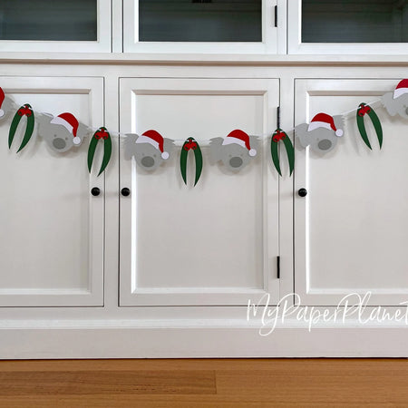 Christmas Koala Garland. Koala in Santa hat banner.