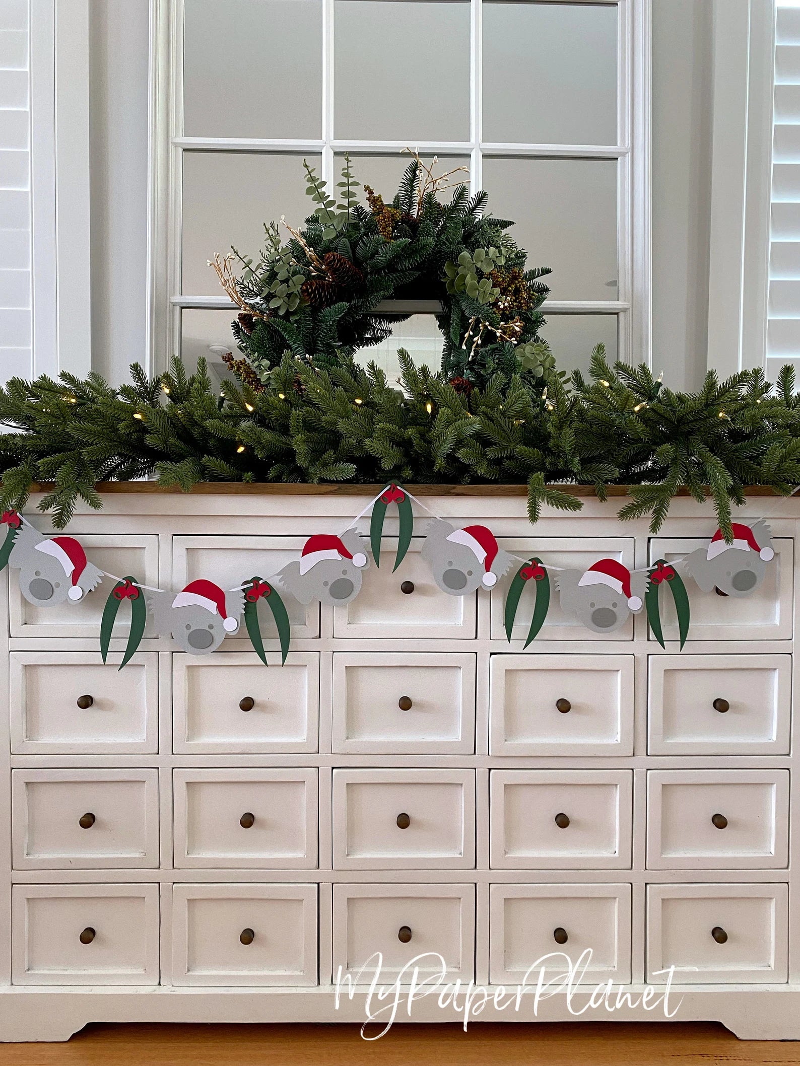Christmas Koala Garland. Koala in Santa hat banner.