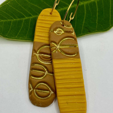 Brown, mustard asymmetrical earrings with texture and gold hoop hooks
