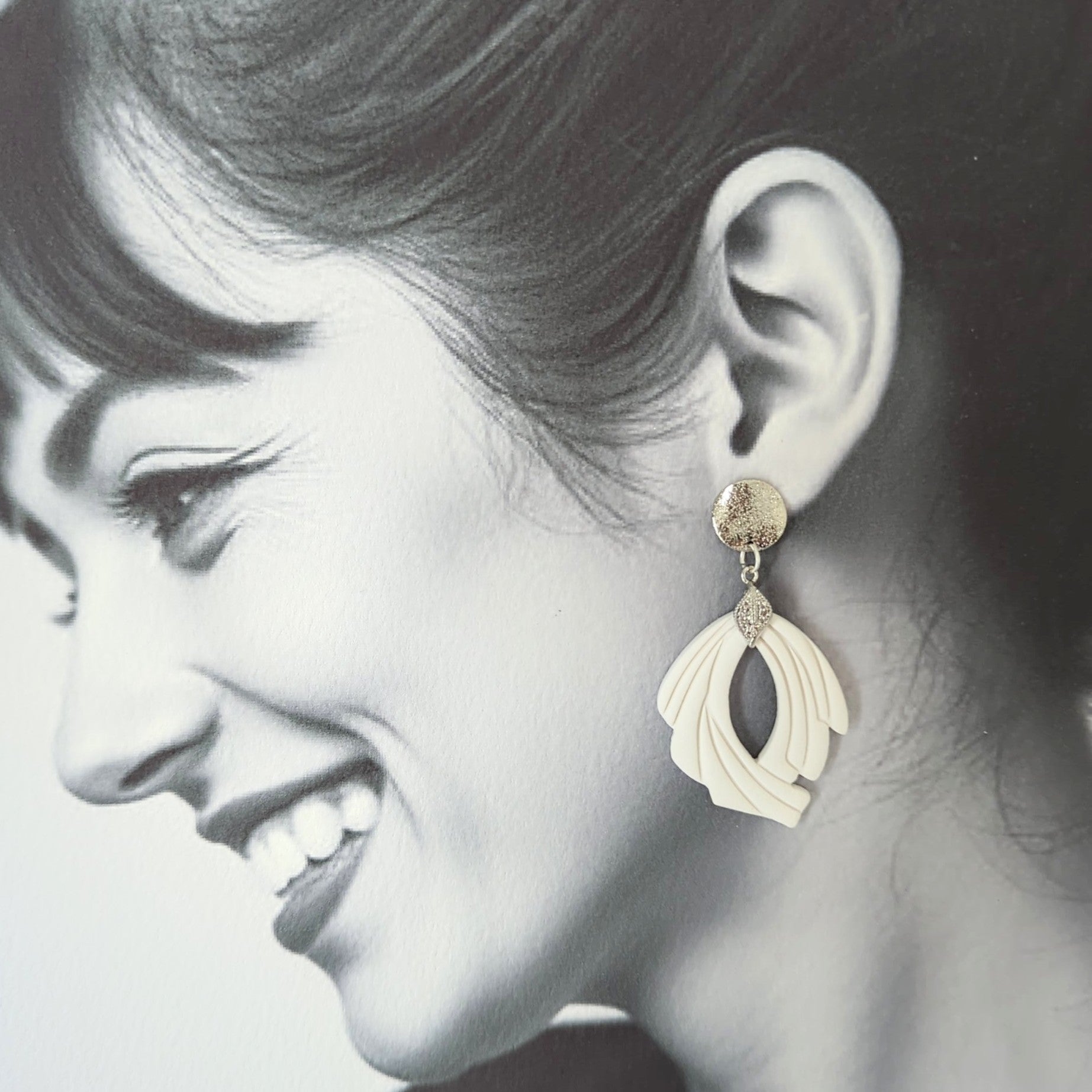 White Earrings with Silver in Different Designs.