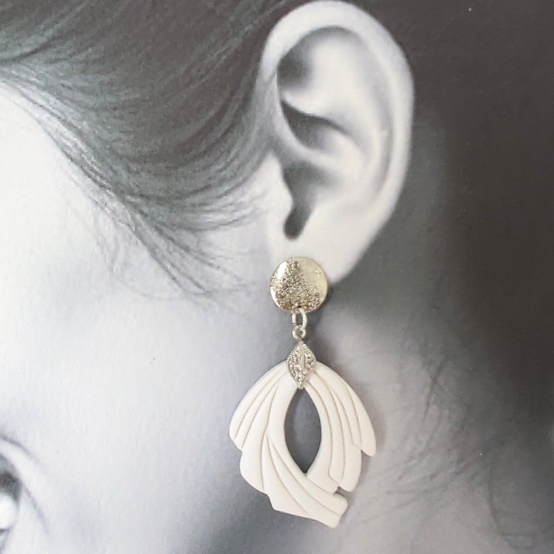 White Earrings with Silver in Different Designs.