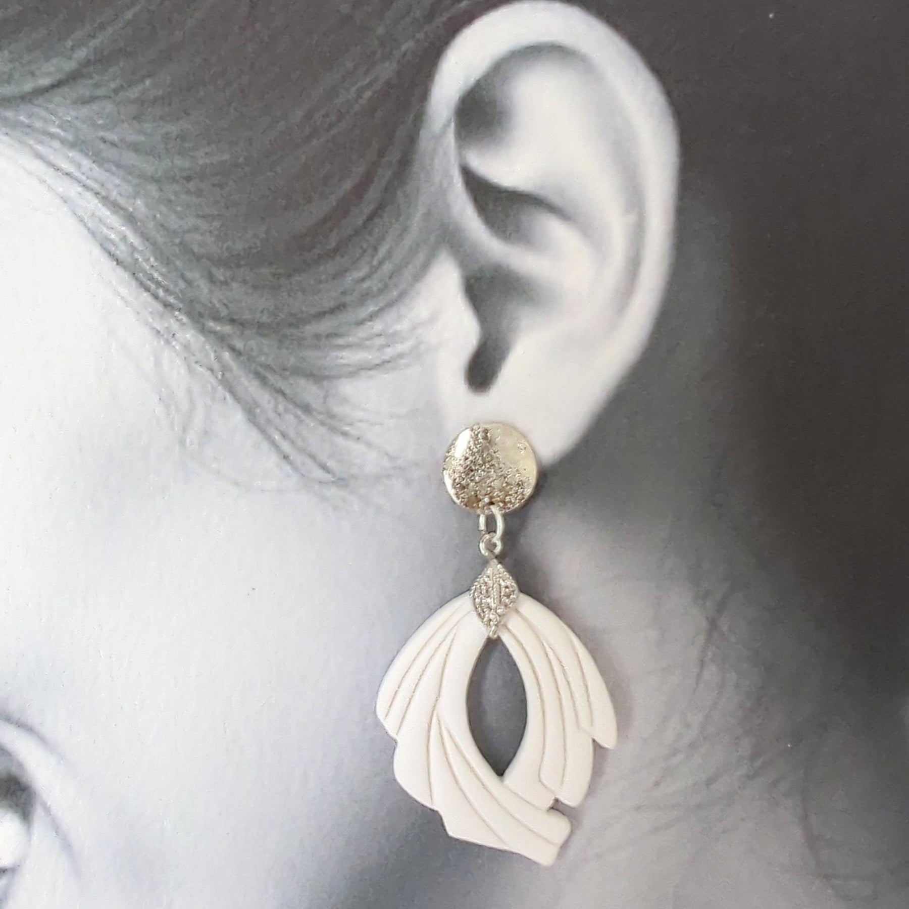 White Earrings with Silver in Different Designs.