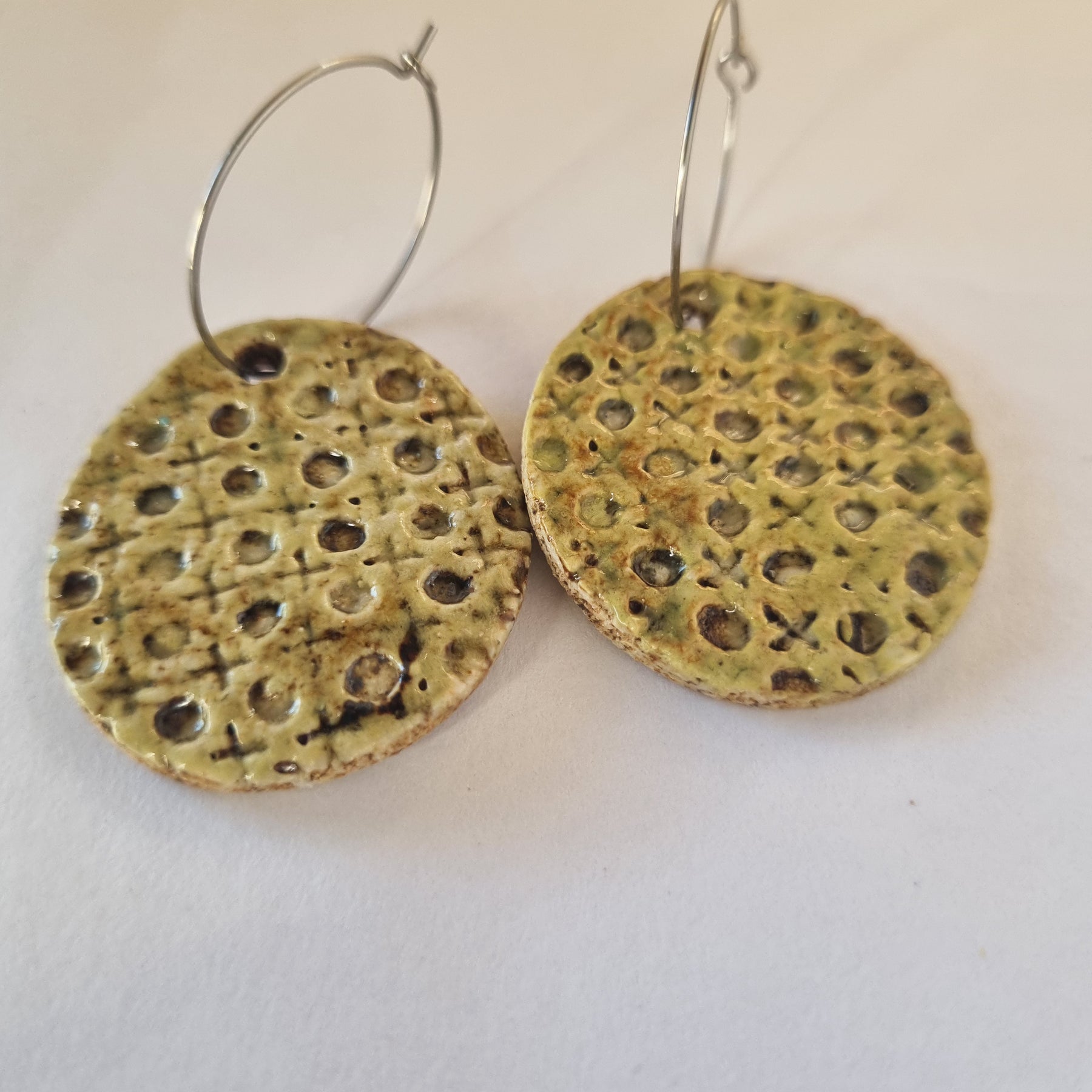 Handmade Stoneware Ceramic Earrings, muted green lattice multi-coloured, 35mm diameter, pierced ears