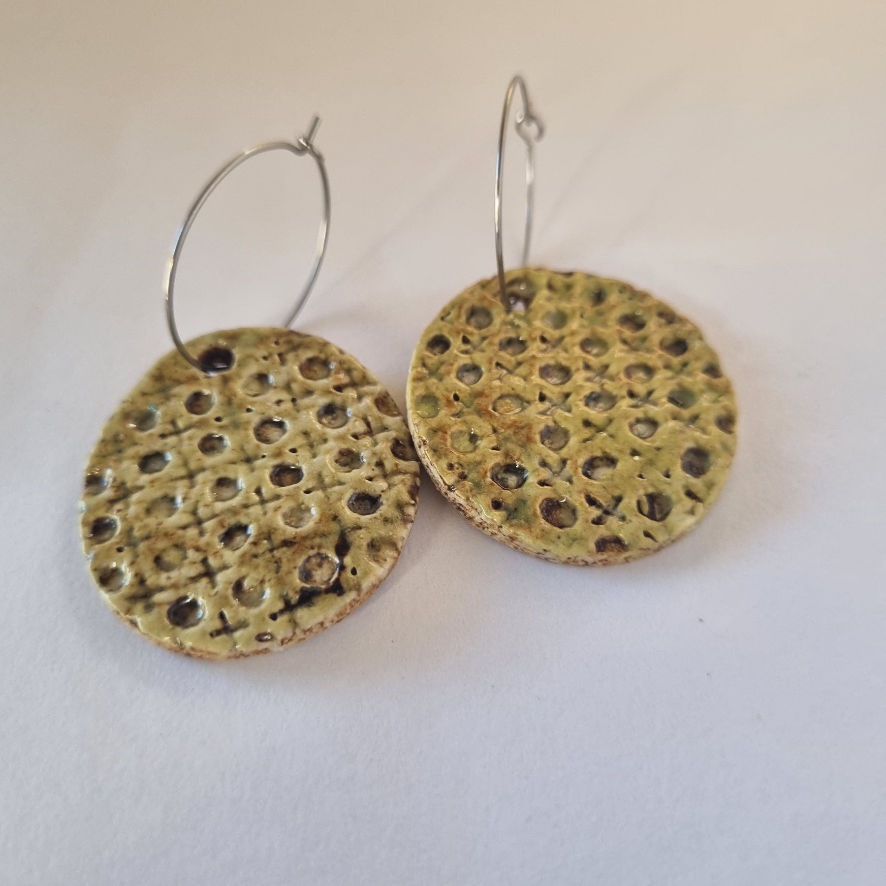 Handmade Stoneware Ceramic Earrings, muted green lattice multi-coloured, 35mm diameter, pierced ears