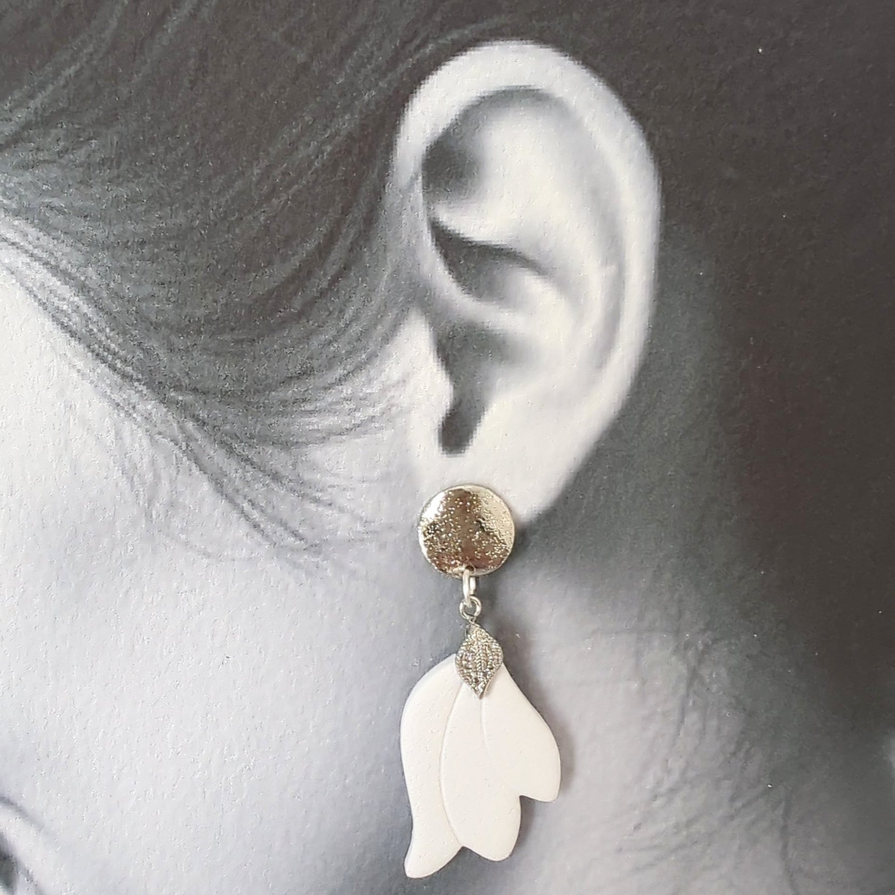 White Earrings with Silver in Different Designs.