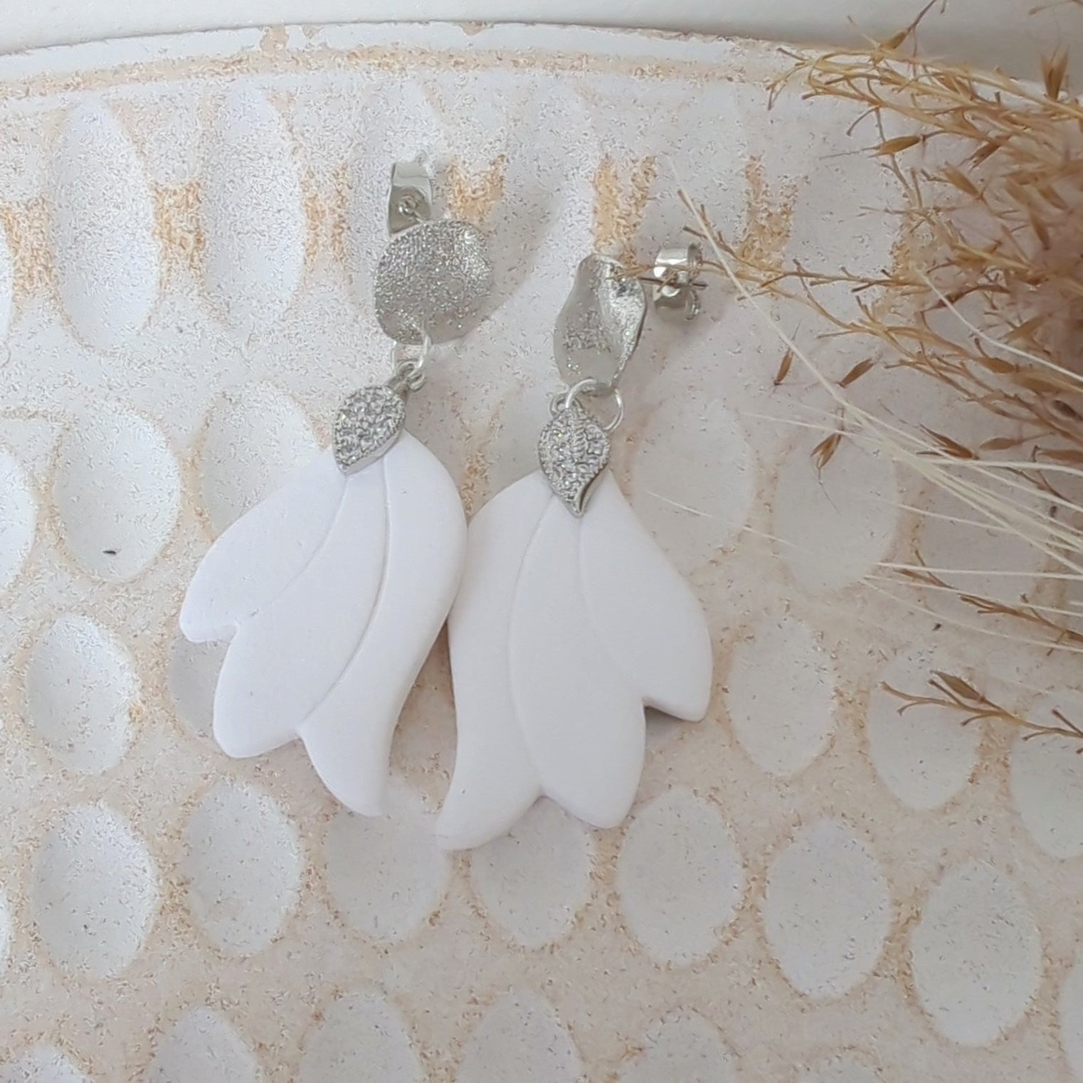 White Earrings with Silver in Different Designs.
