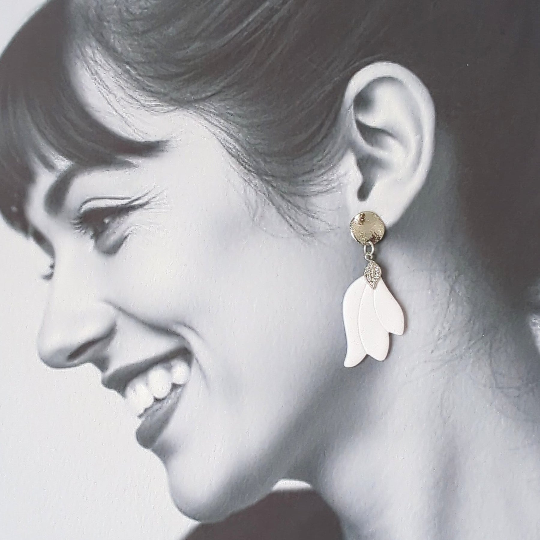 White Earrings with Silver in Different Designs.