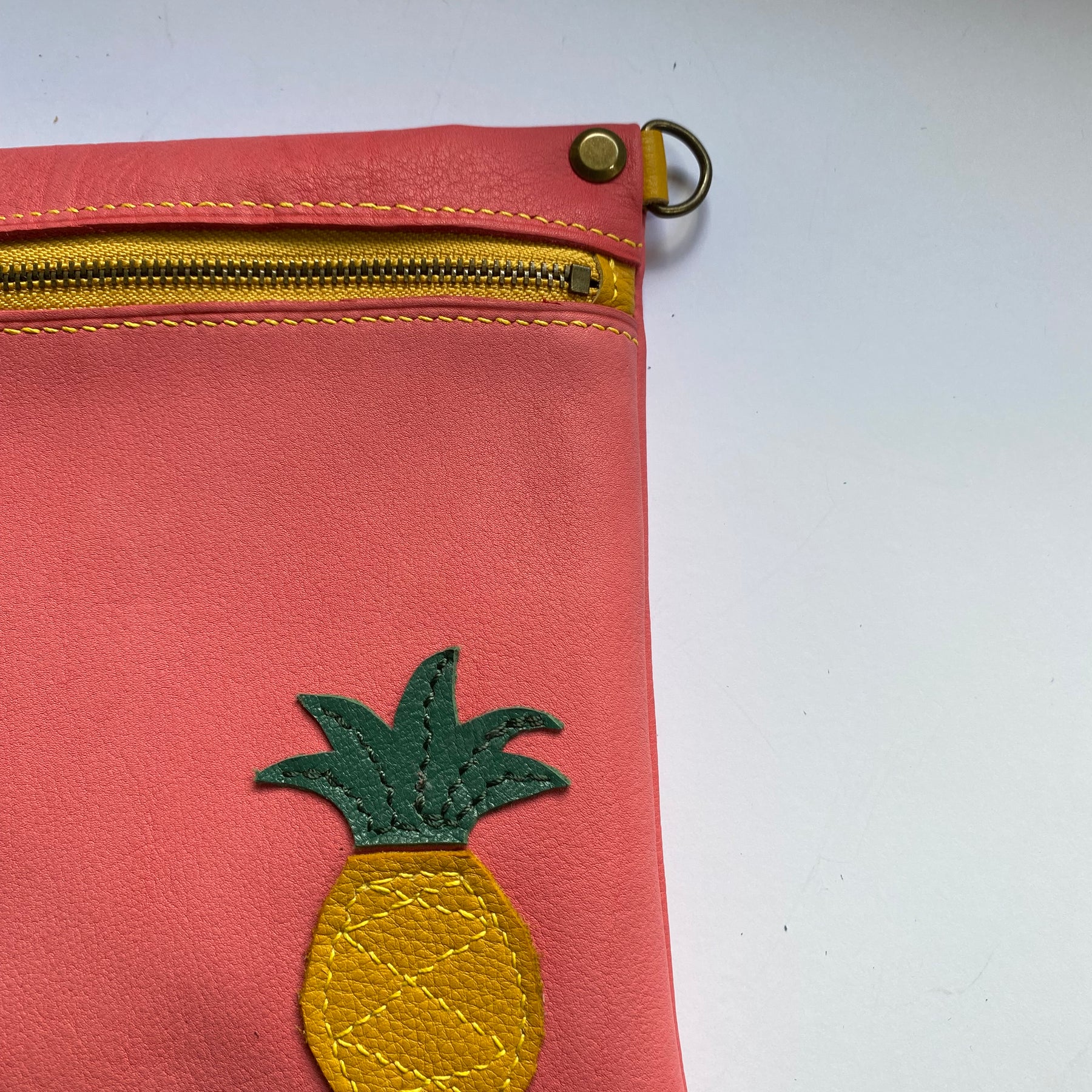 Leather crossbody bag with pineapple motif
