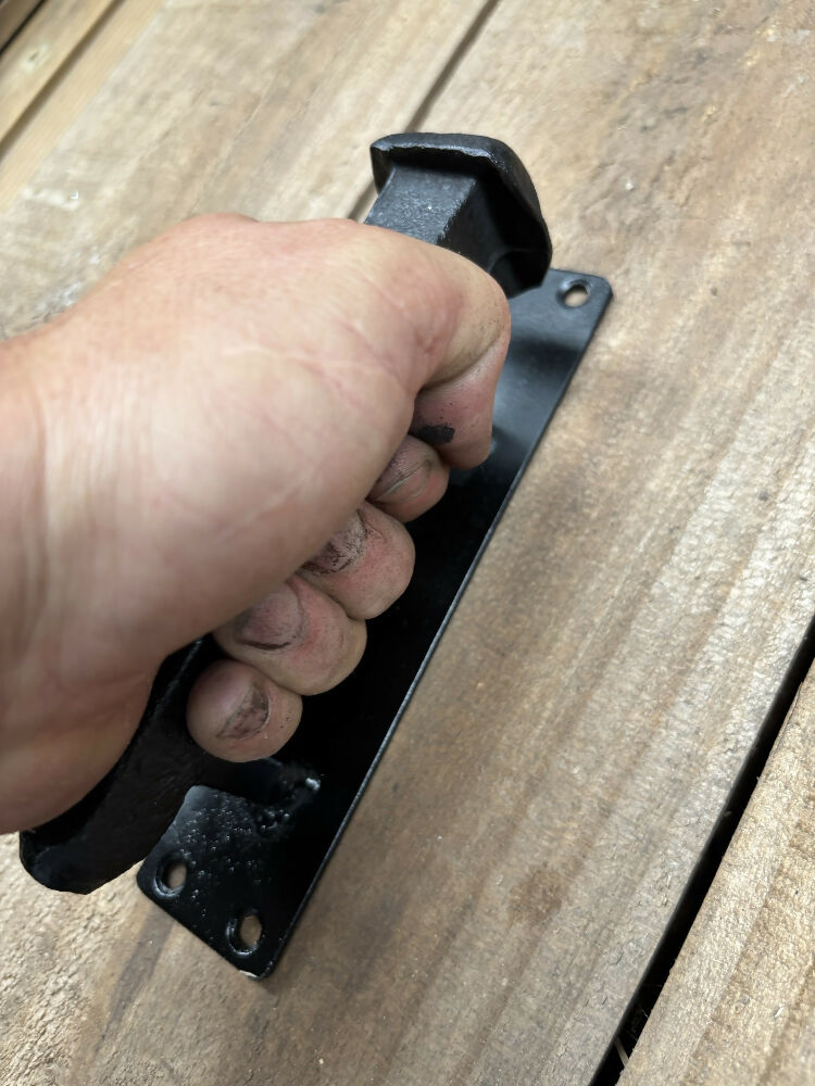 Railways spike door handle grip on wooden door
