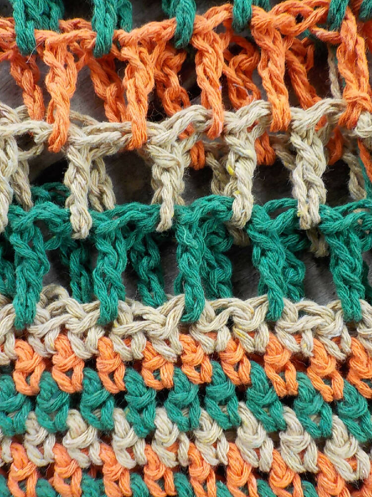 crocheted shopping carry string bag made from green, orange and beige cotton