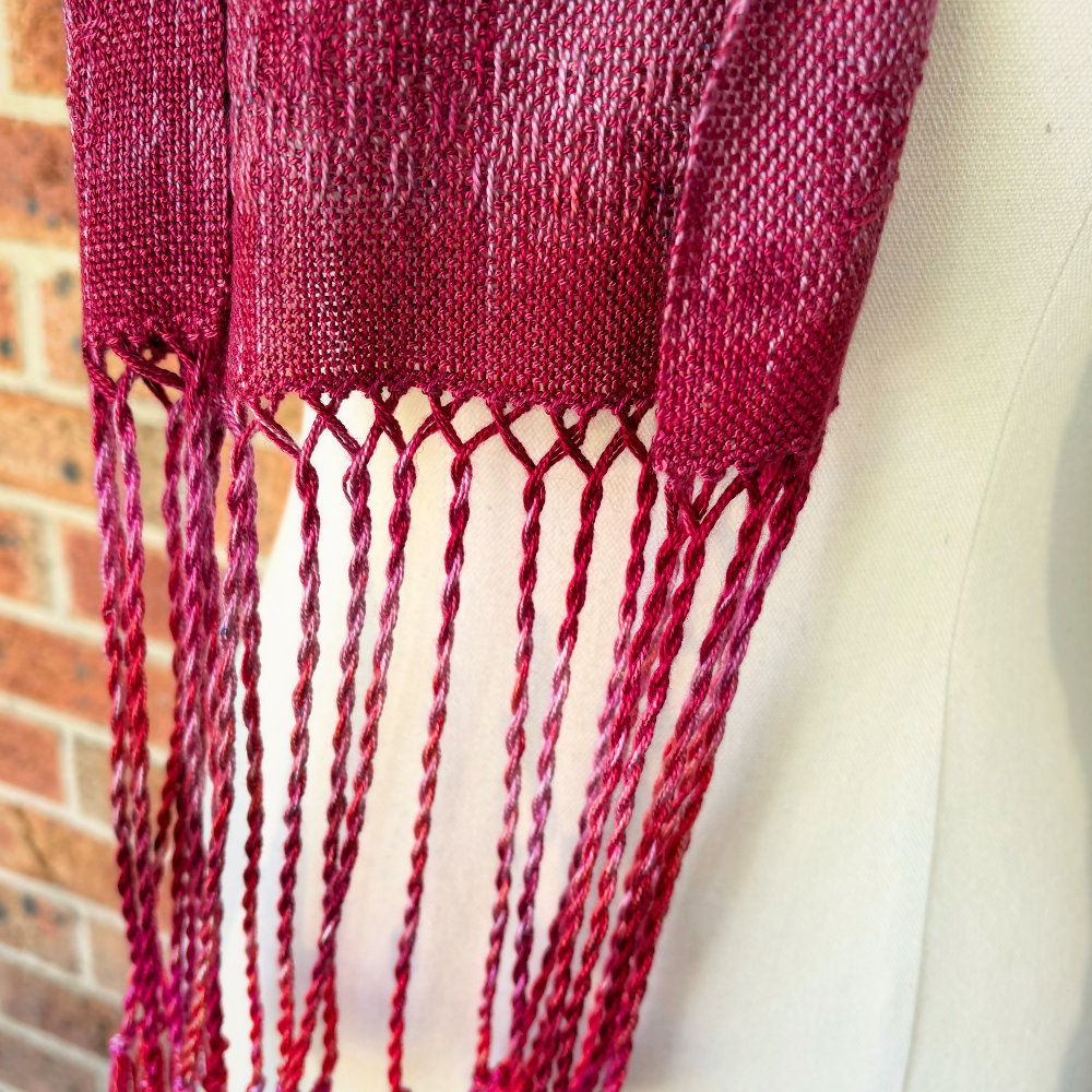 Dark-pink-tencel-scarf-closeup-fringe-mannequin-handwoven-entangled-happiness-handwovens