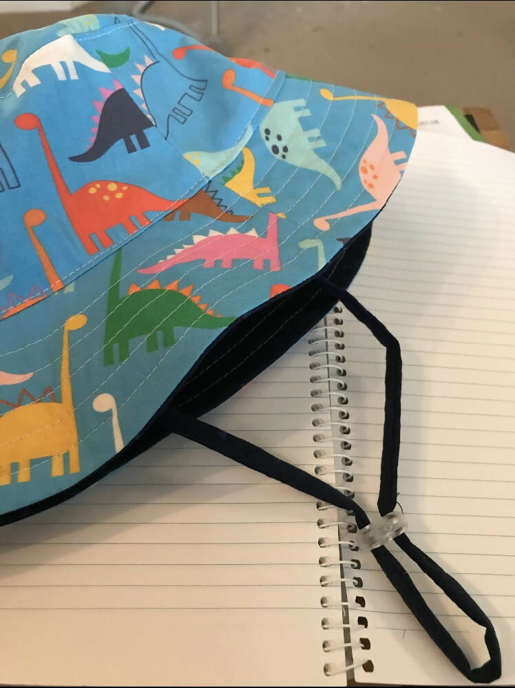 Summer hat in watercolour (pink) dinosaur fabric