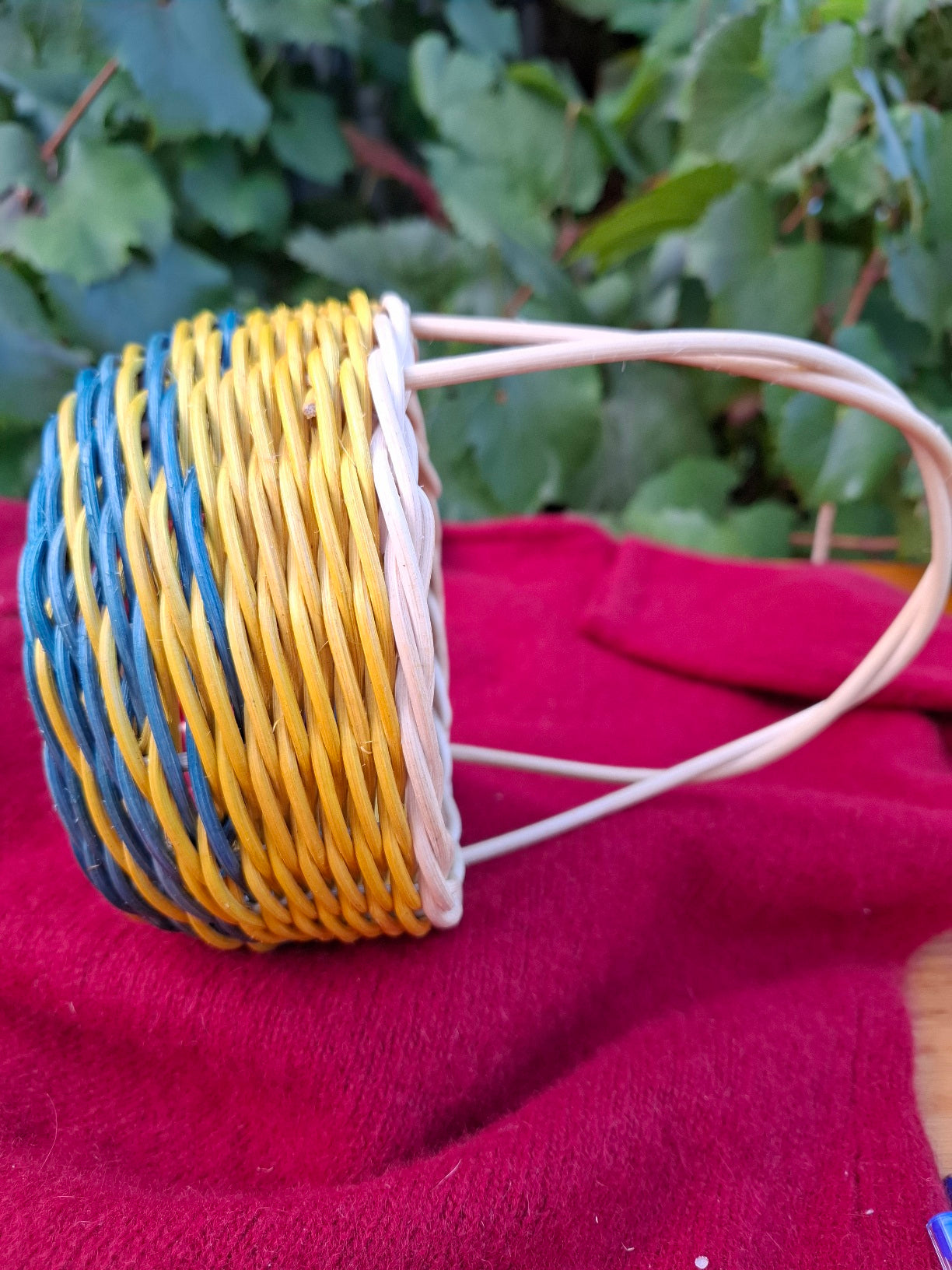 Small blue yellow handled basket