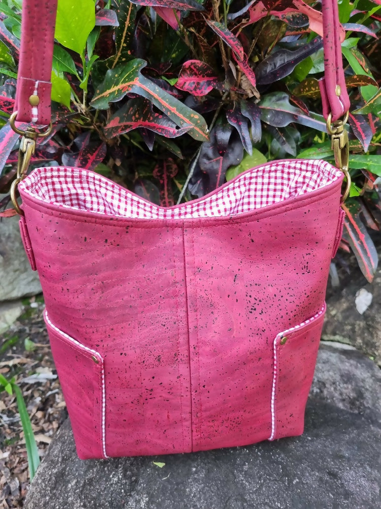 Rear view showing a slip pocket on each side of red wine coloured cork.