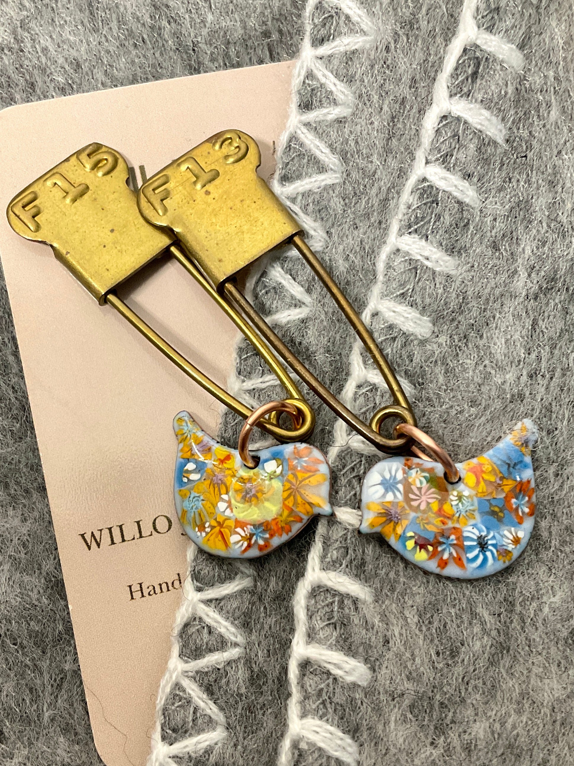 Bird scarf pin.