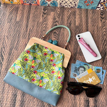 Kiss Lock Clutch with Vinyl Handle