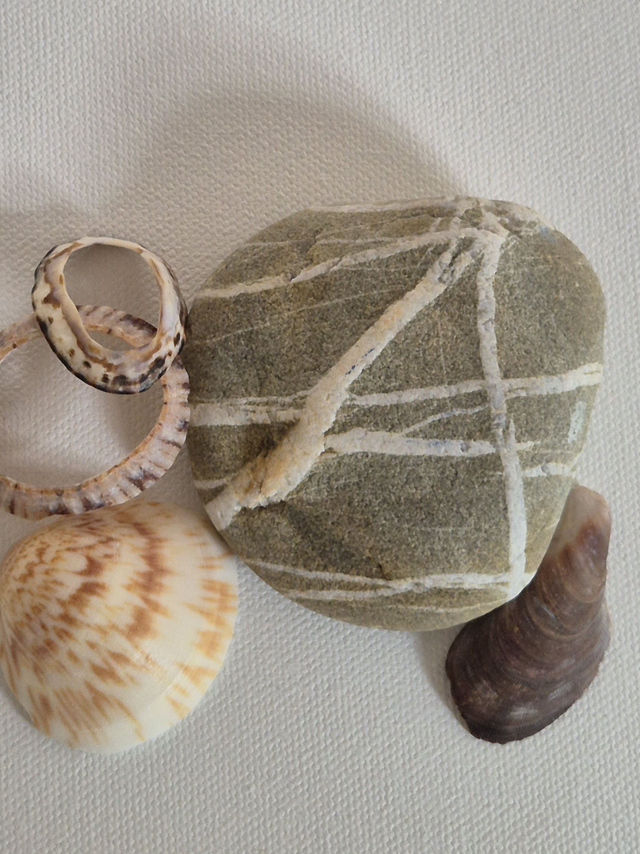 Original linocut art titled Shells and Stones