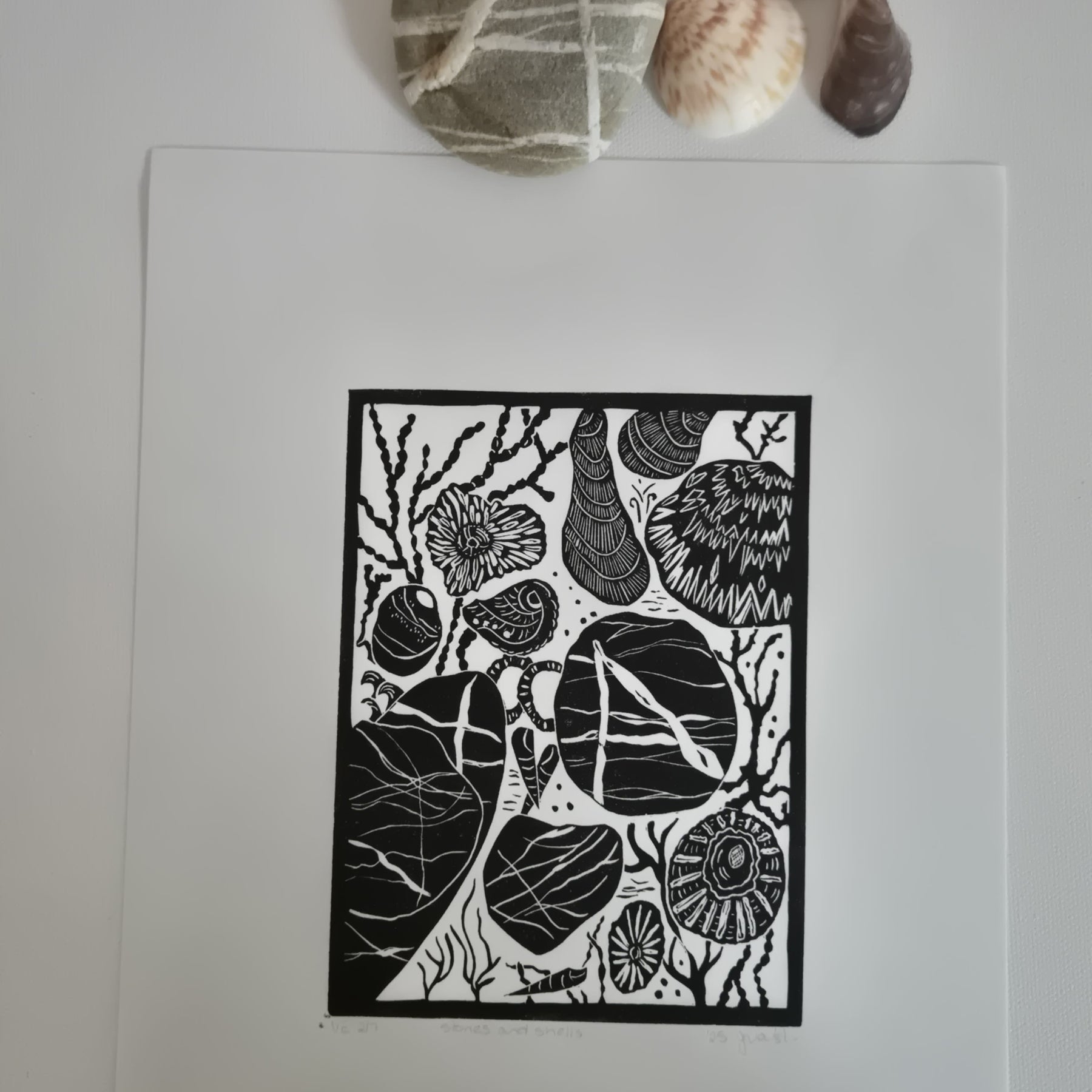 Original linocut art titled Shells and Stones