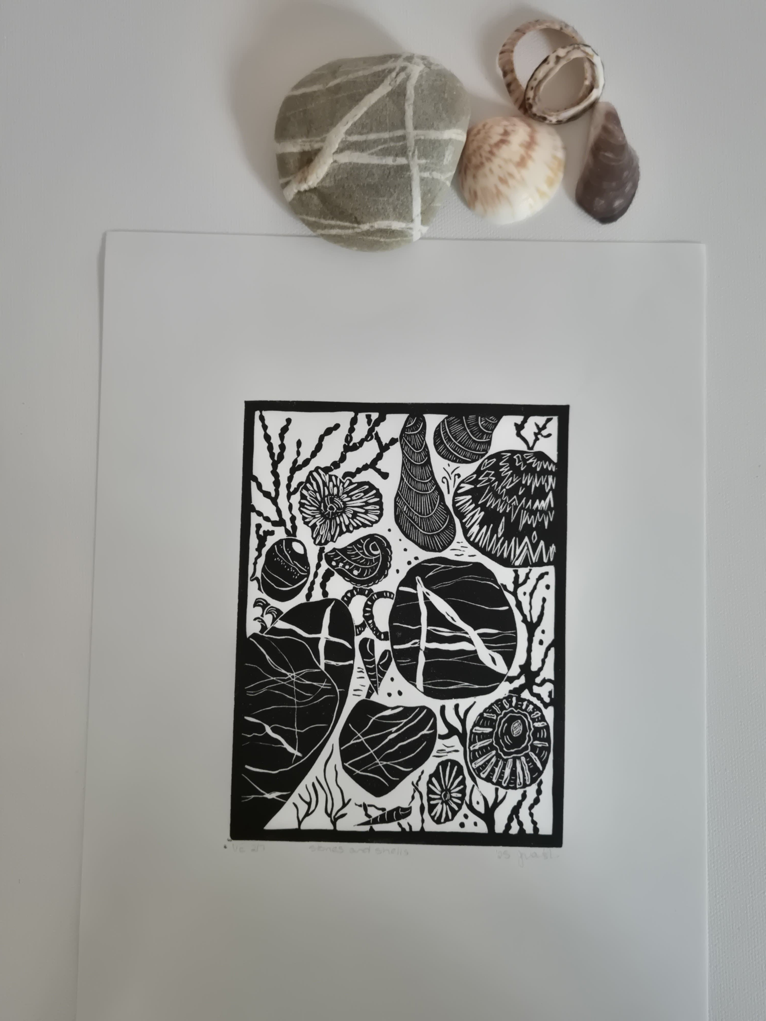 Original linocut art titled Shells and Stones
