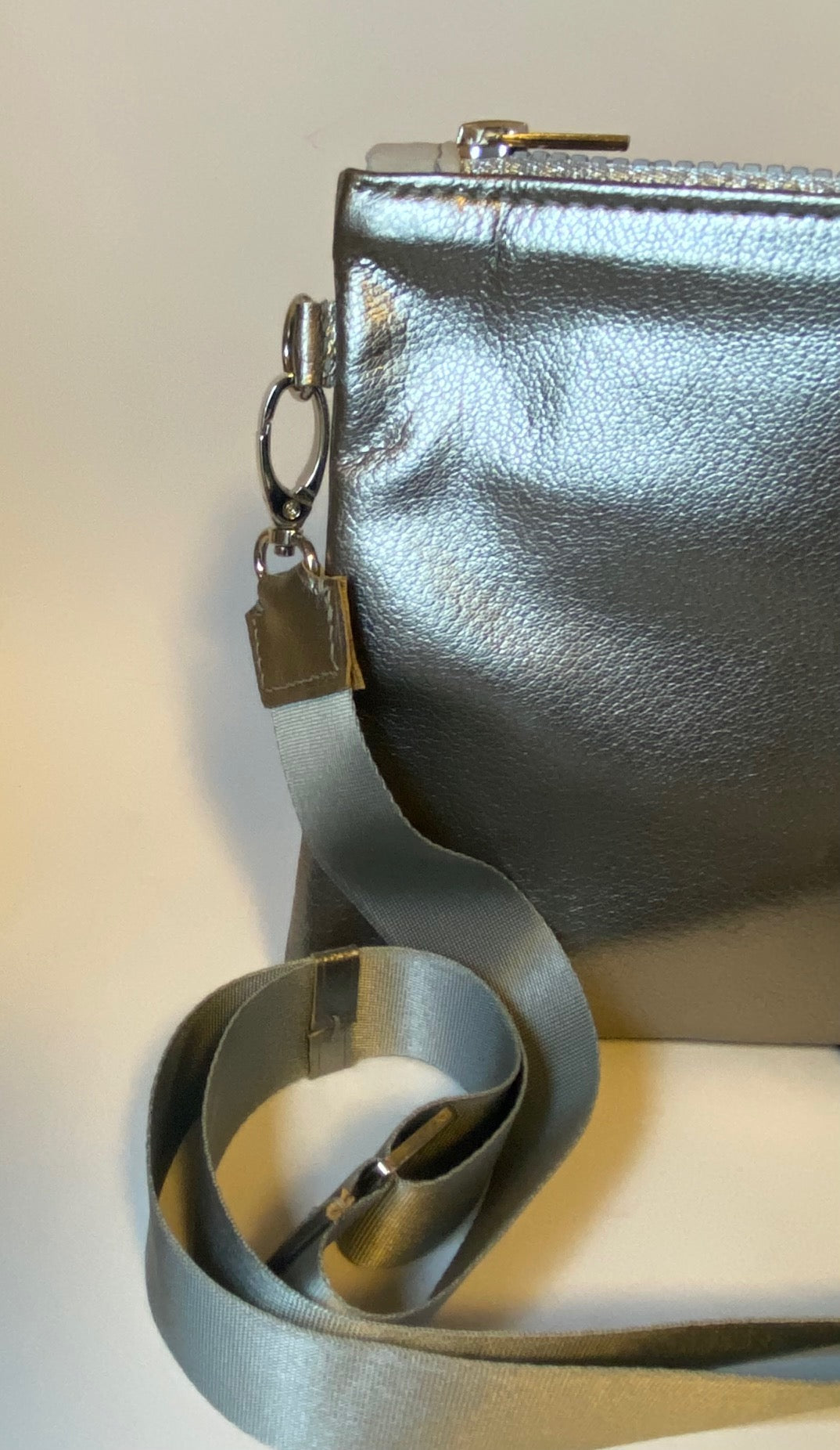 Metallic silver zip top crossbody bag