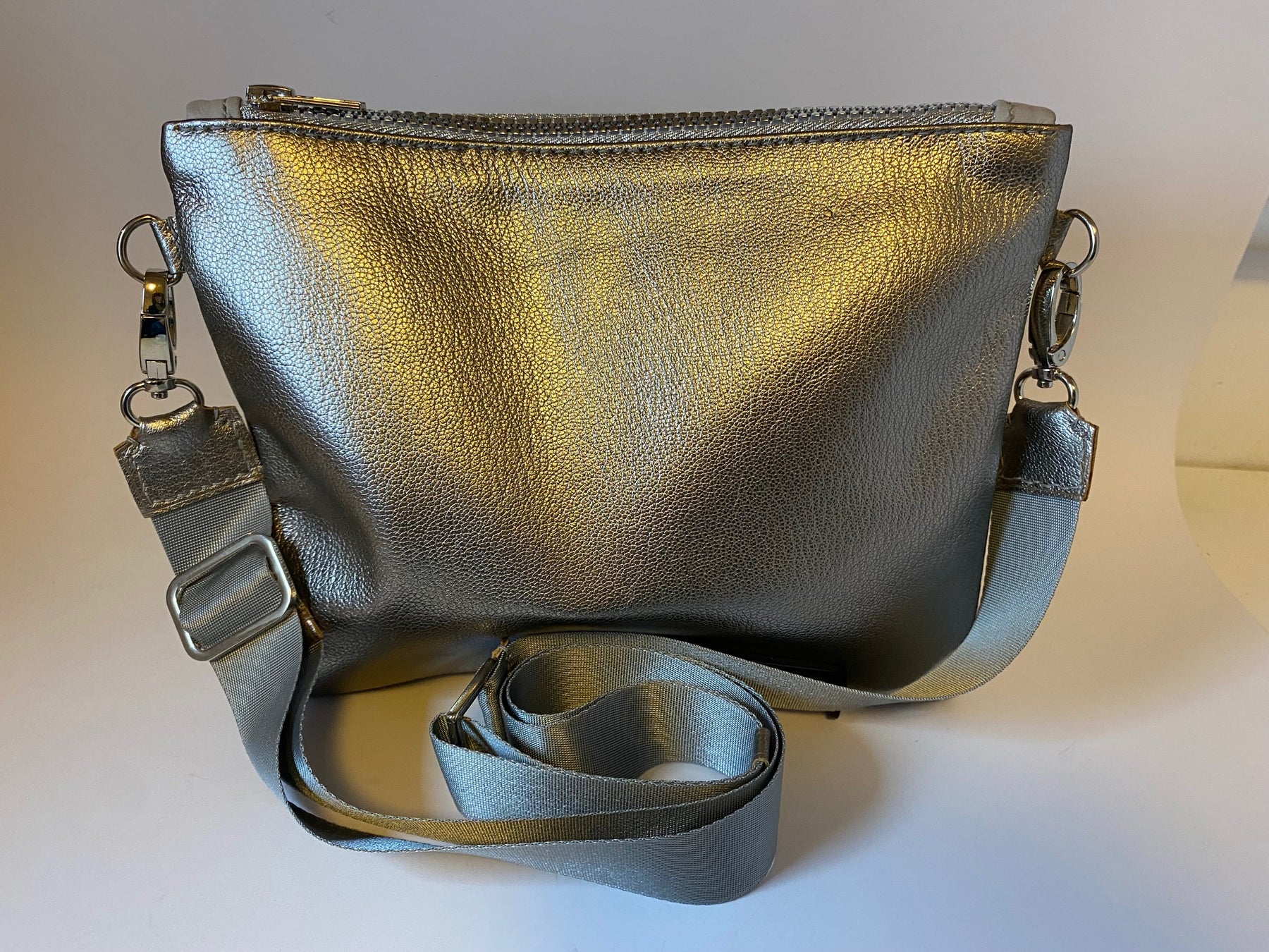 Metallic silver zip top crossbody bag