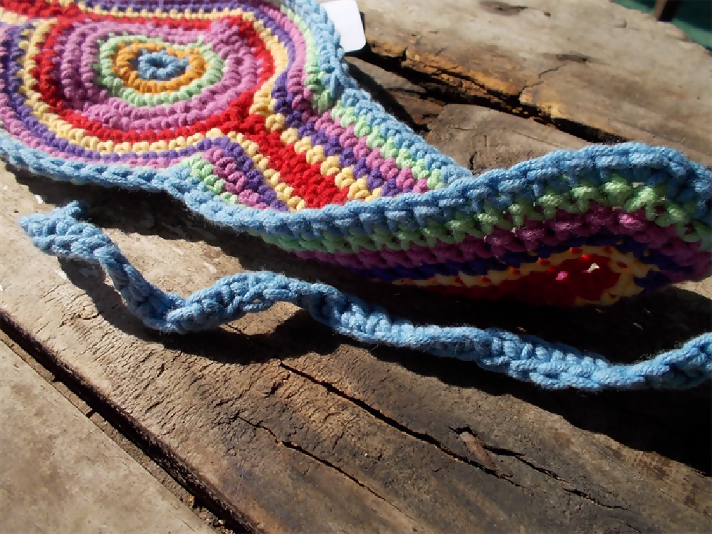 Crocheted headband in rainbow colours