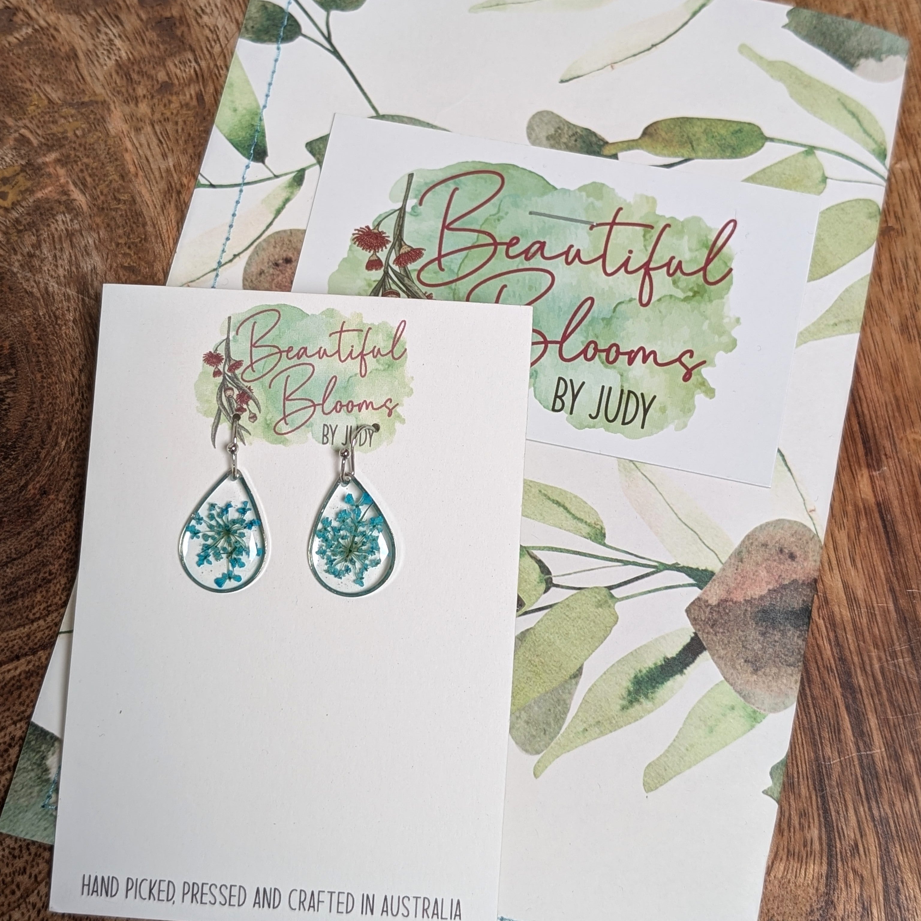 Teardrop silver earrings with teal Queen Anne's Lace