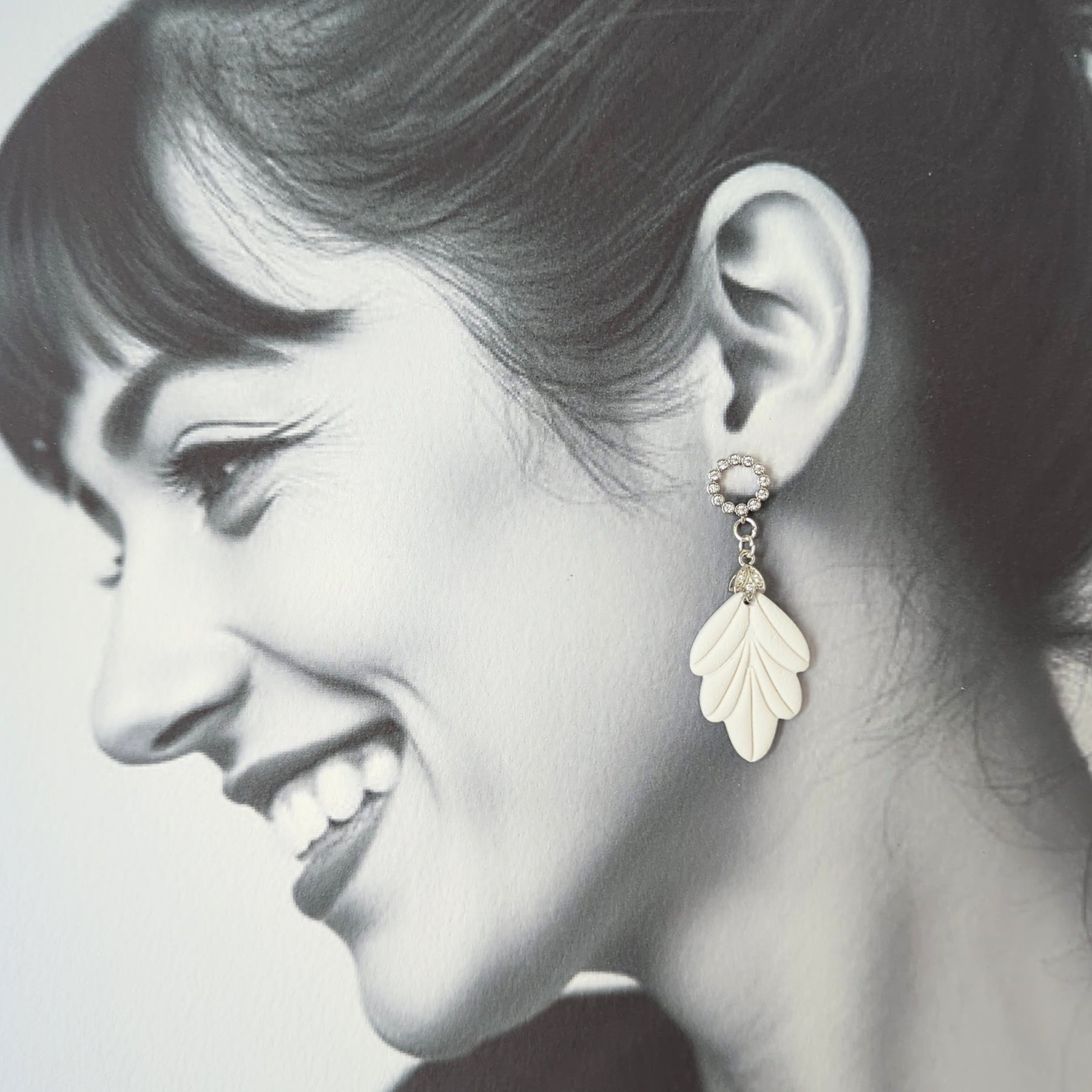 White Earrings with Silver in Different Designs.