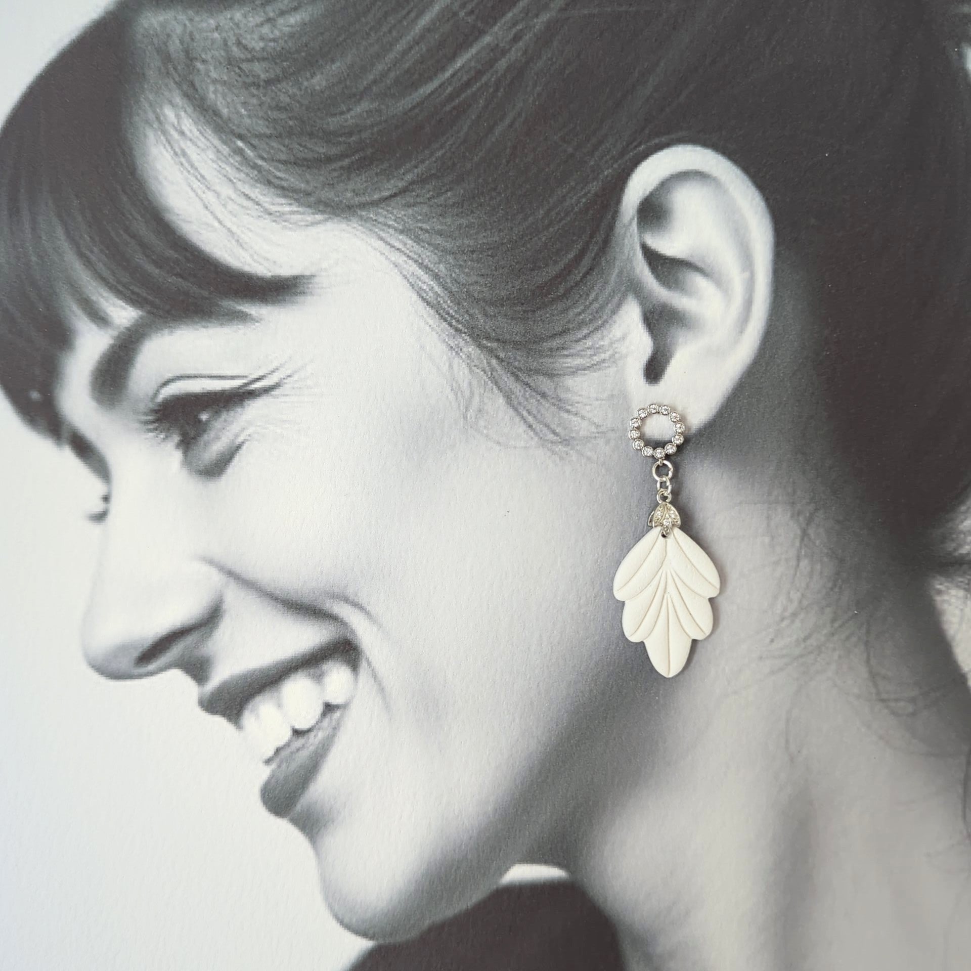 White Earrings with Silver in Different Designs.