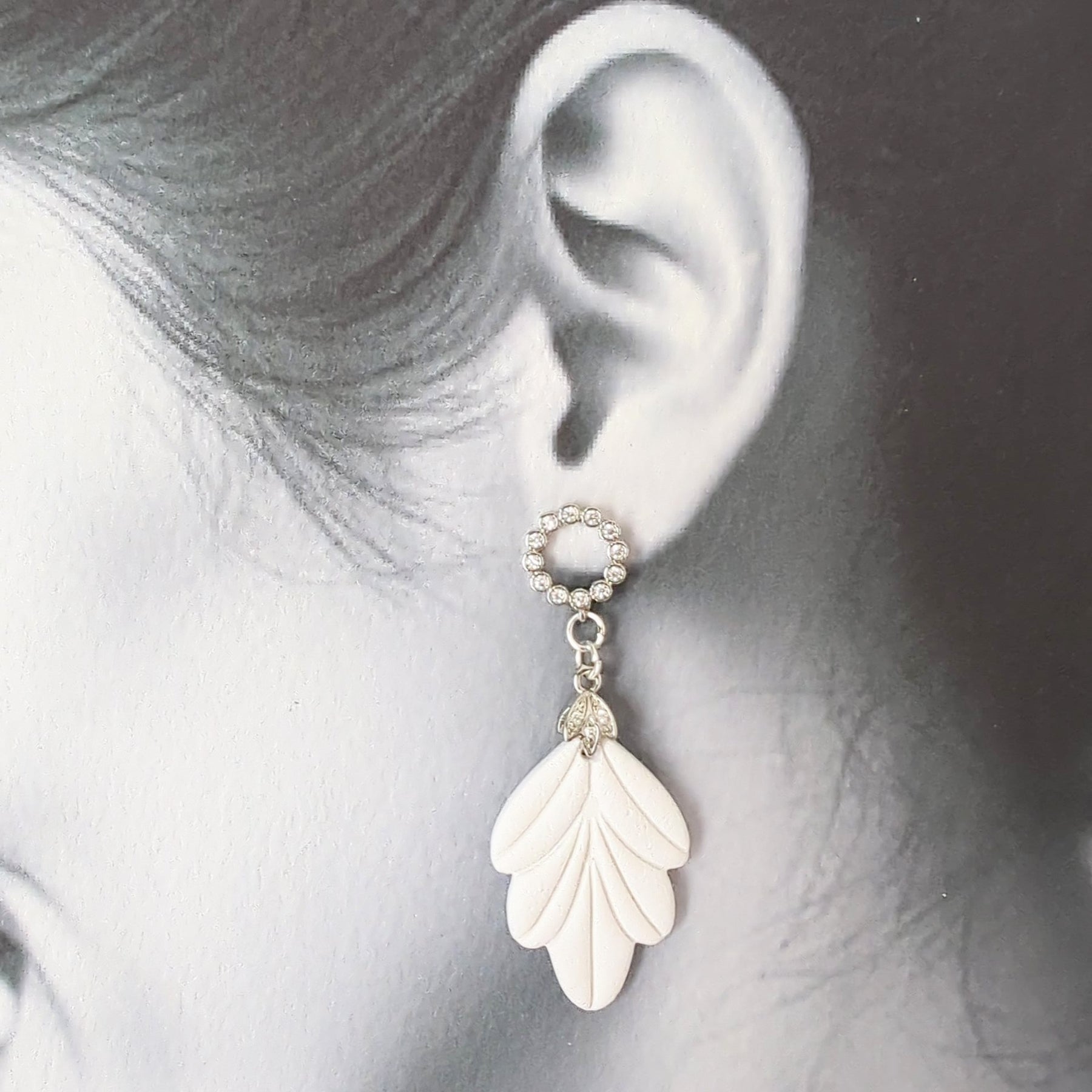 White Earrings with Silver in Different Designs.