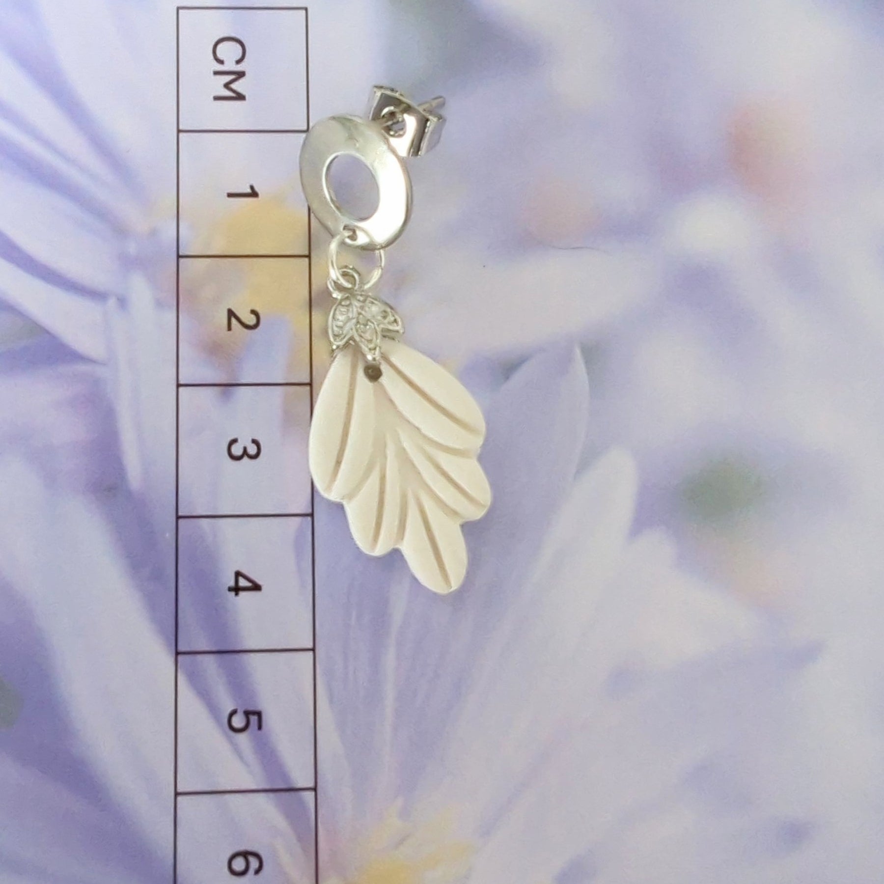 White Earrings with Silver in Different Designs.