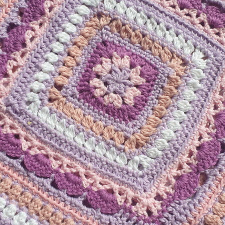 Beautiful crochet cotton afghan in pink/lilacs