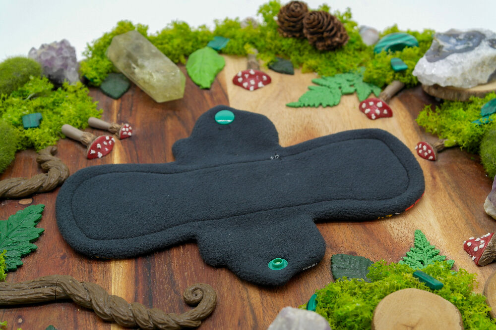 dig the flow reusables reusable cloth pad australian handmade red green mushrooms bamboo lycra black bird cotton unique one-of-a-kind flutter menstrual health business - softshell waterproof backer