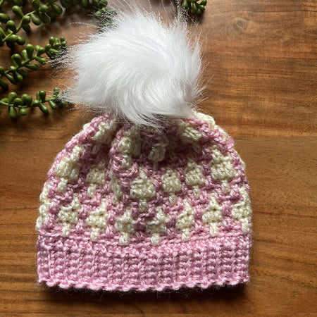 Pink and white children’s beanie