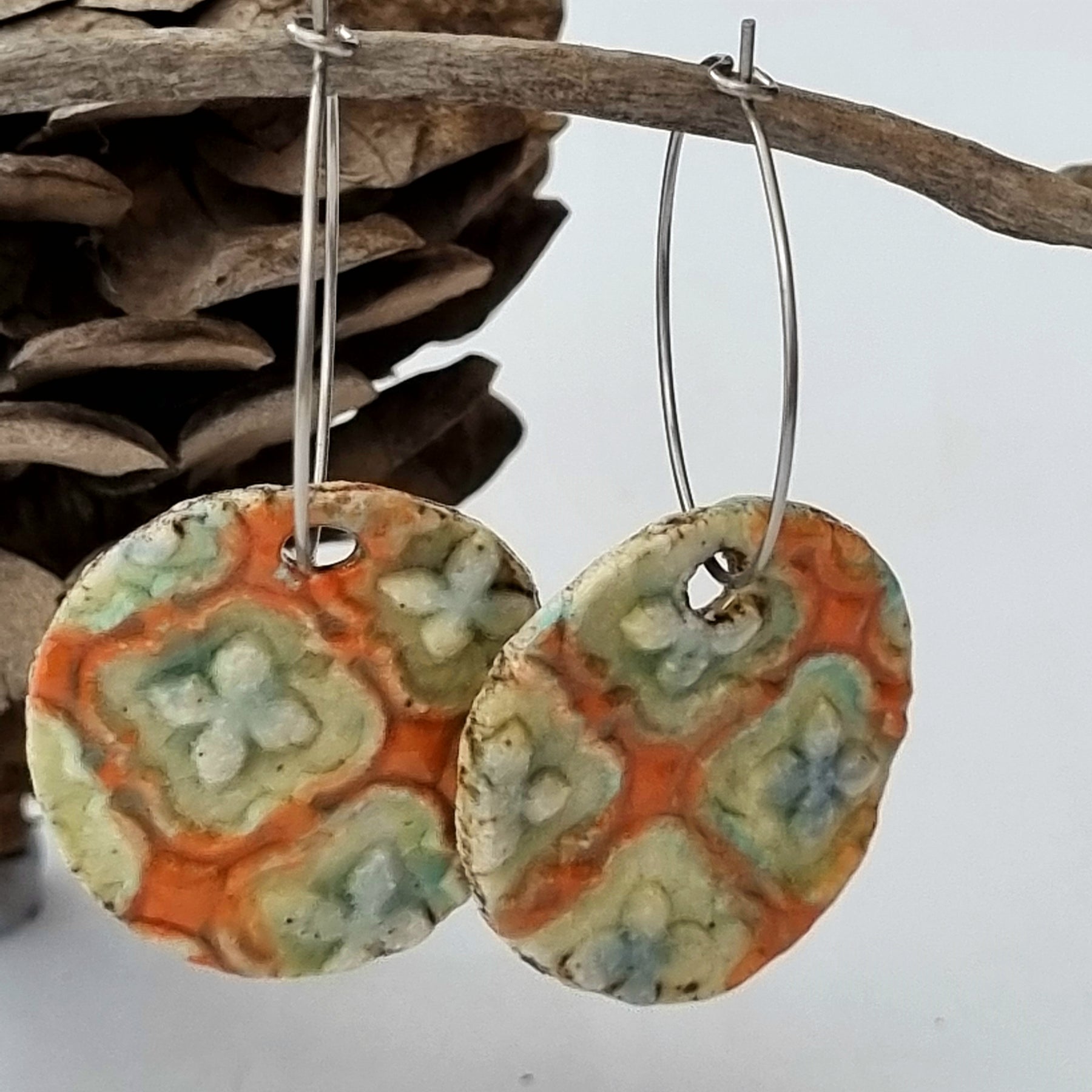 Handmade Stoneware Ceramic Earrings, orange multi-coloured, 28mm diameter, pierced ears