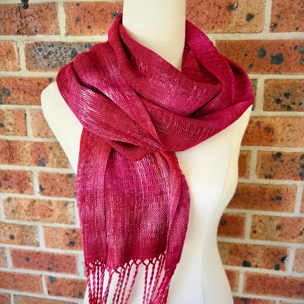 Dark-pink-tencel-scarf-draped-mannequin-closeup-handwoven-entangled-happiness-handwovens