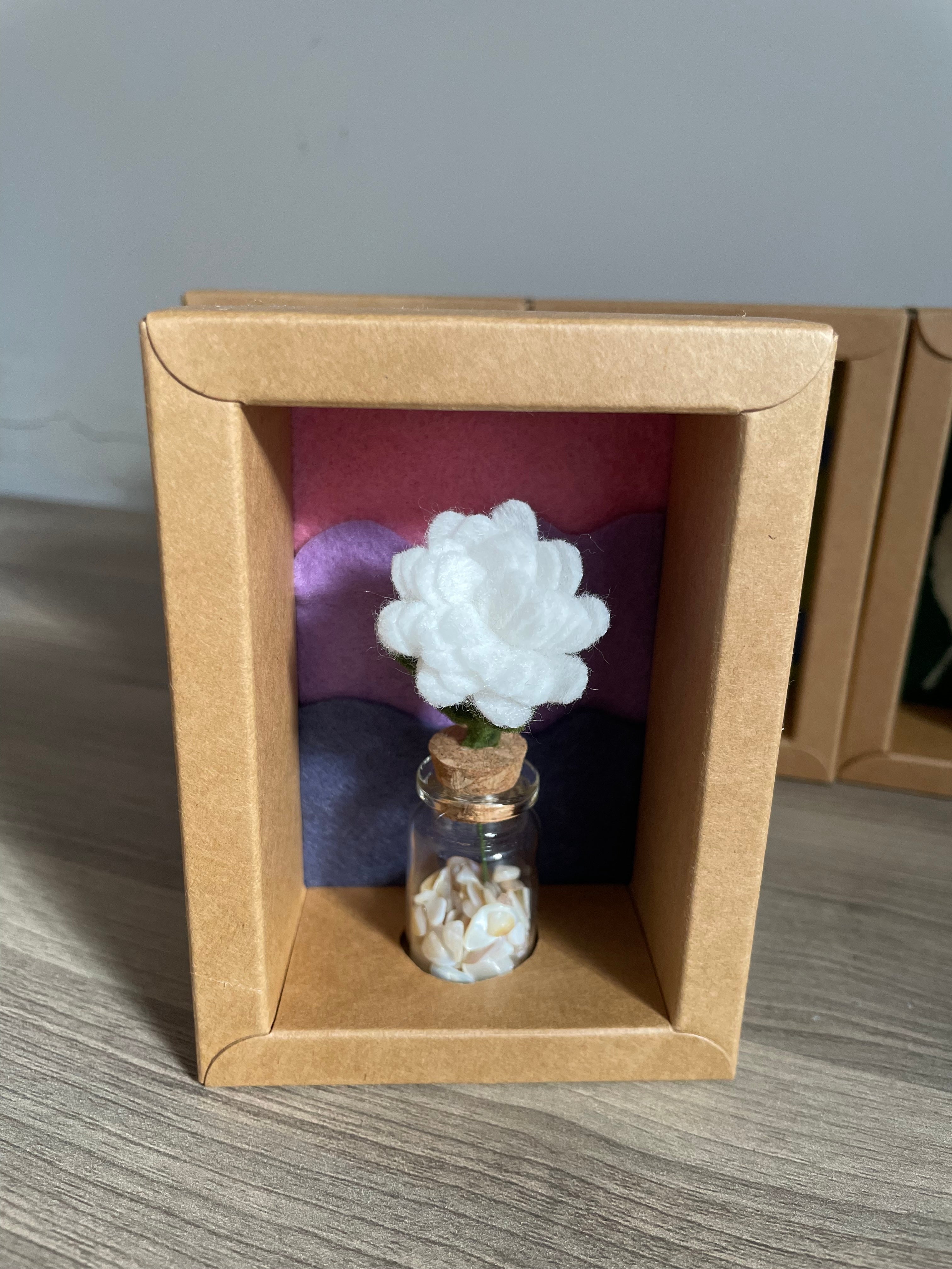 Minature flower in glass jar