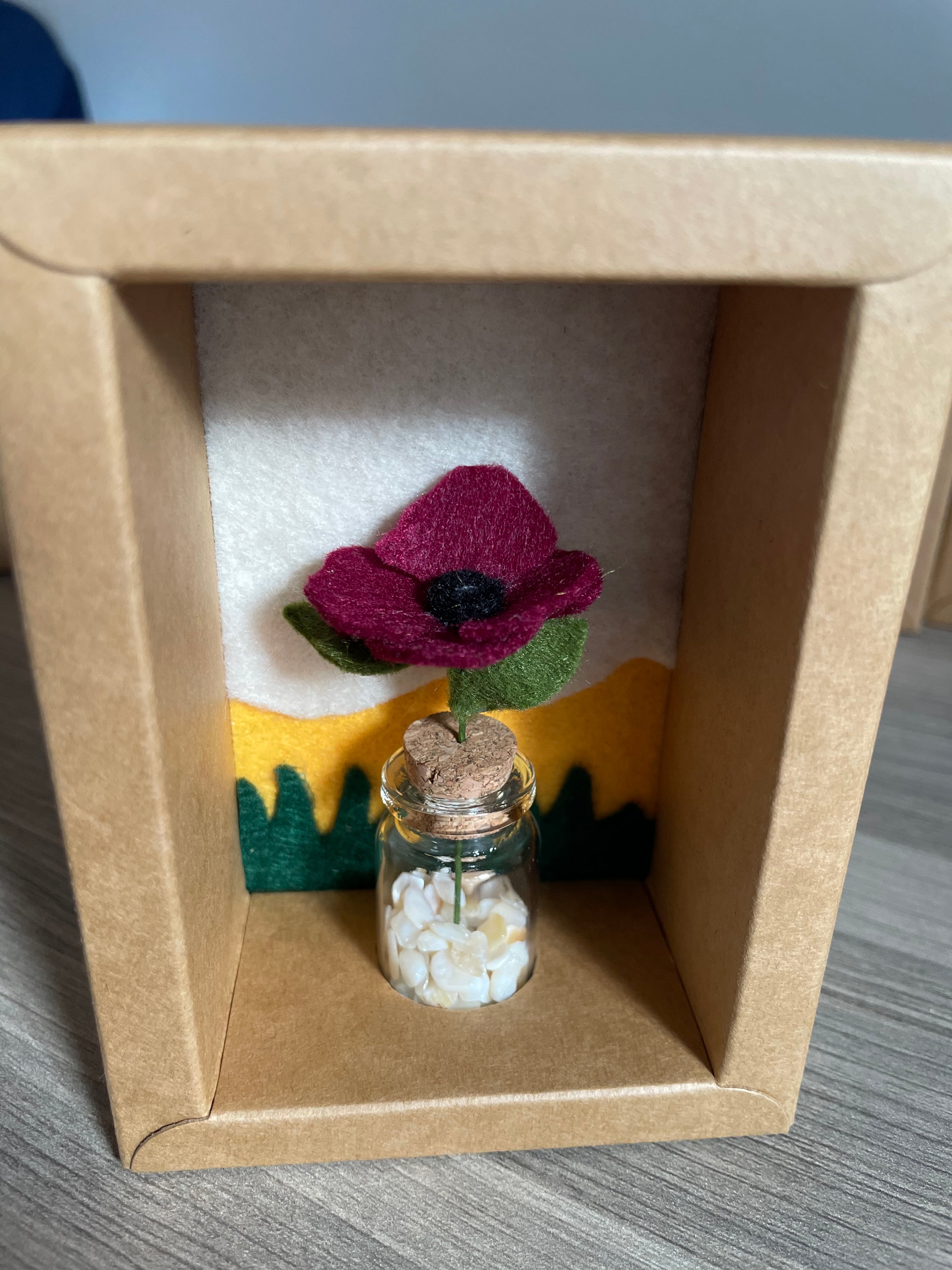 Minature flower in glass jar