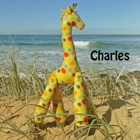 Handmade giraffes frollicking at the Beach: