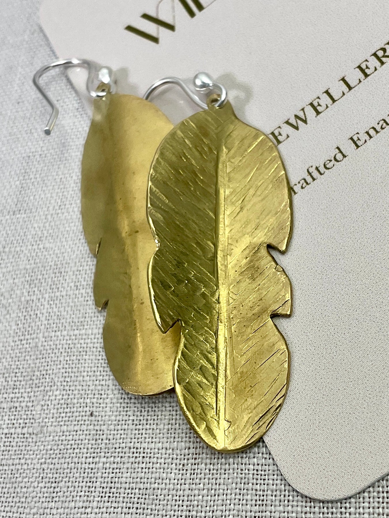 Brass leaf earrings.