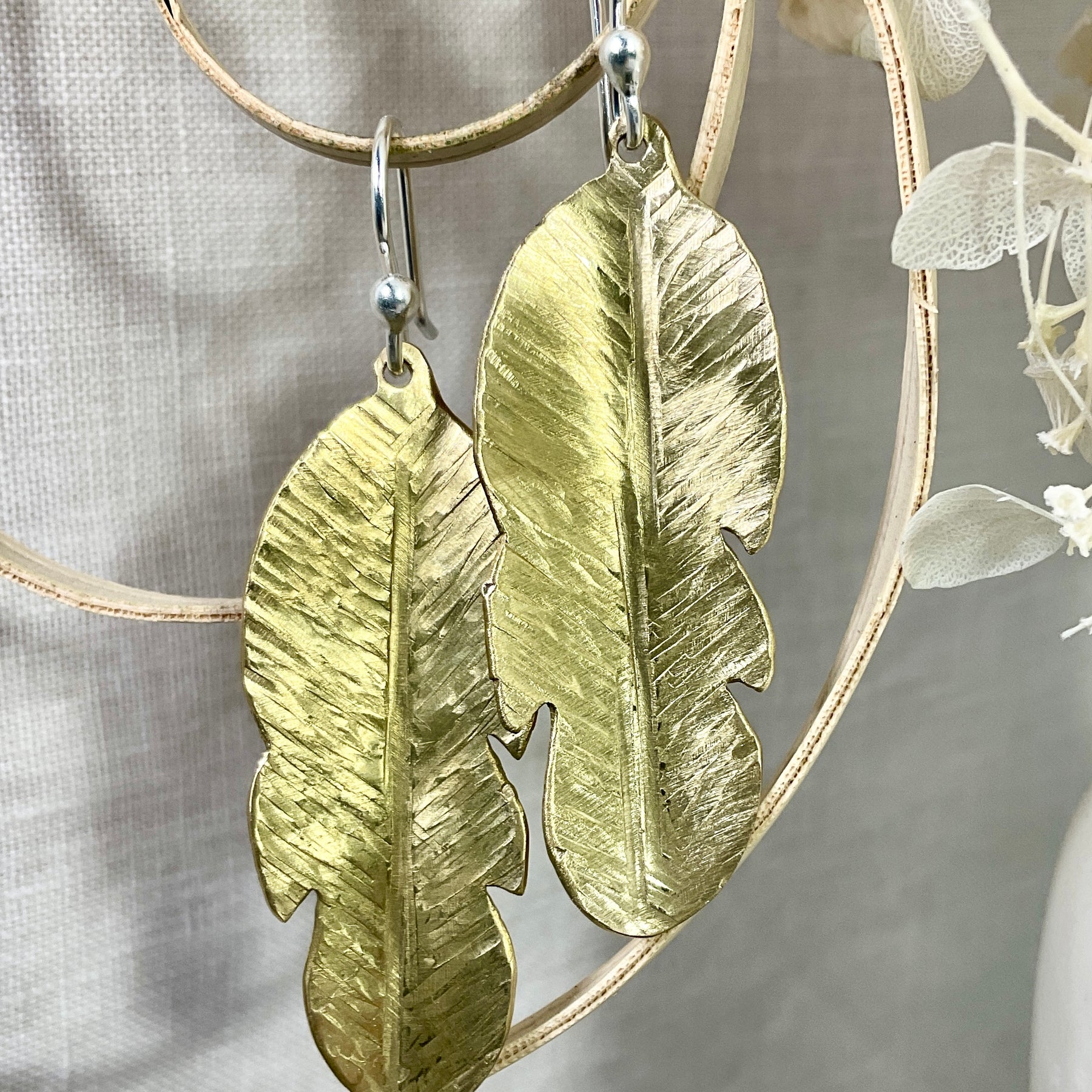 Brass leaf earrings.