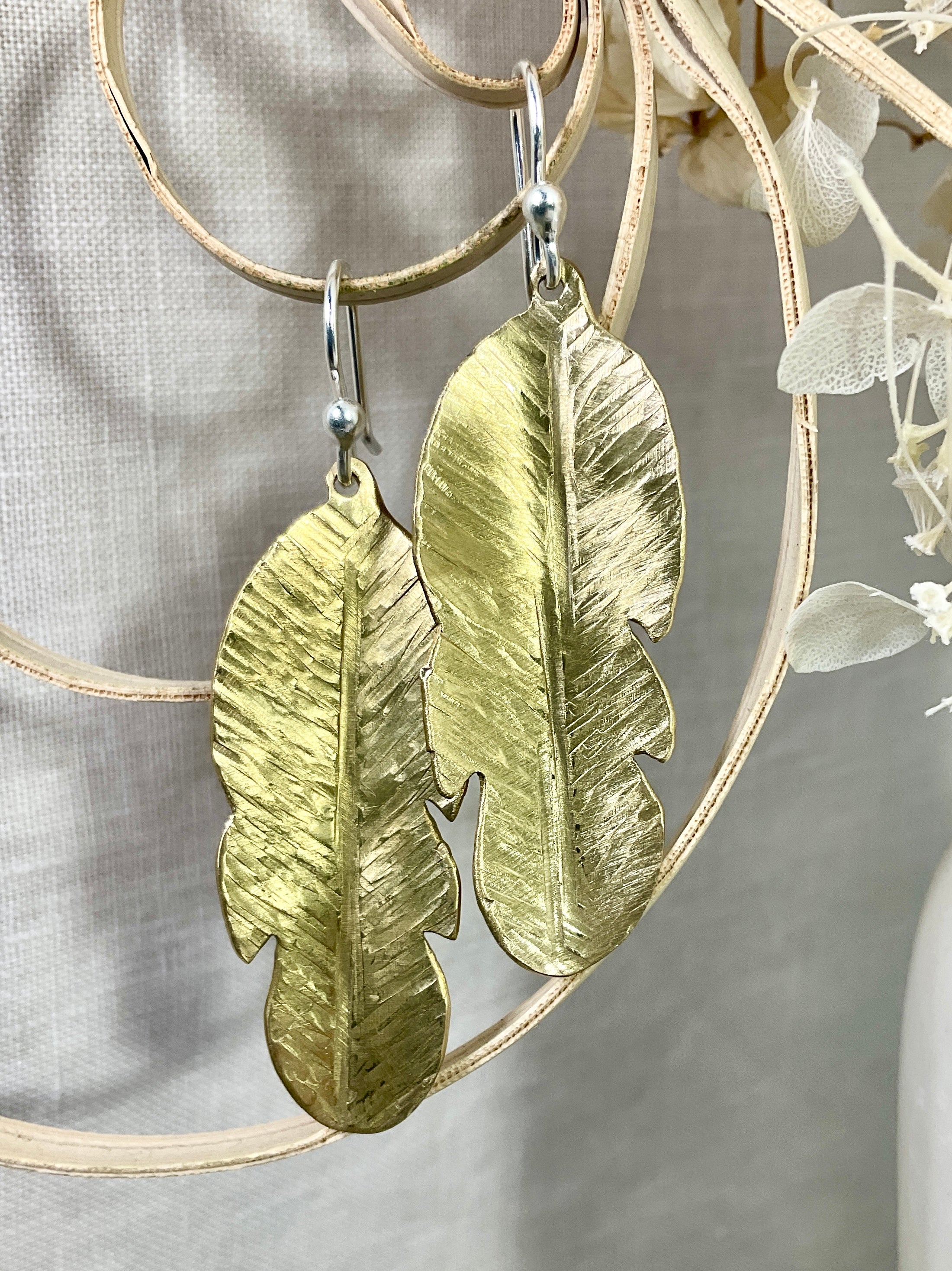 Brass leaf earrings.