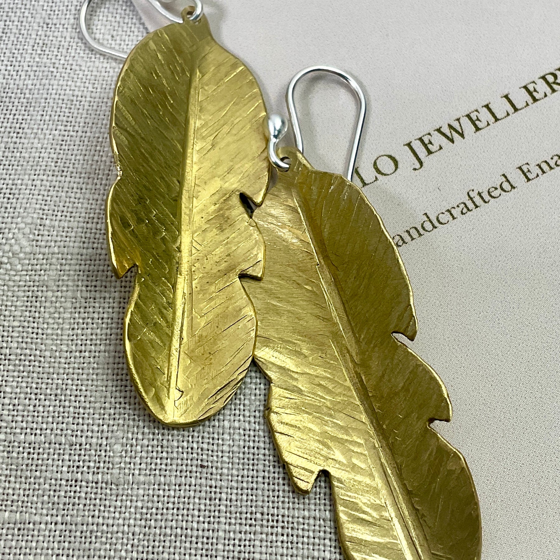 Brass leaf earrings.