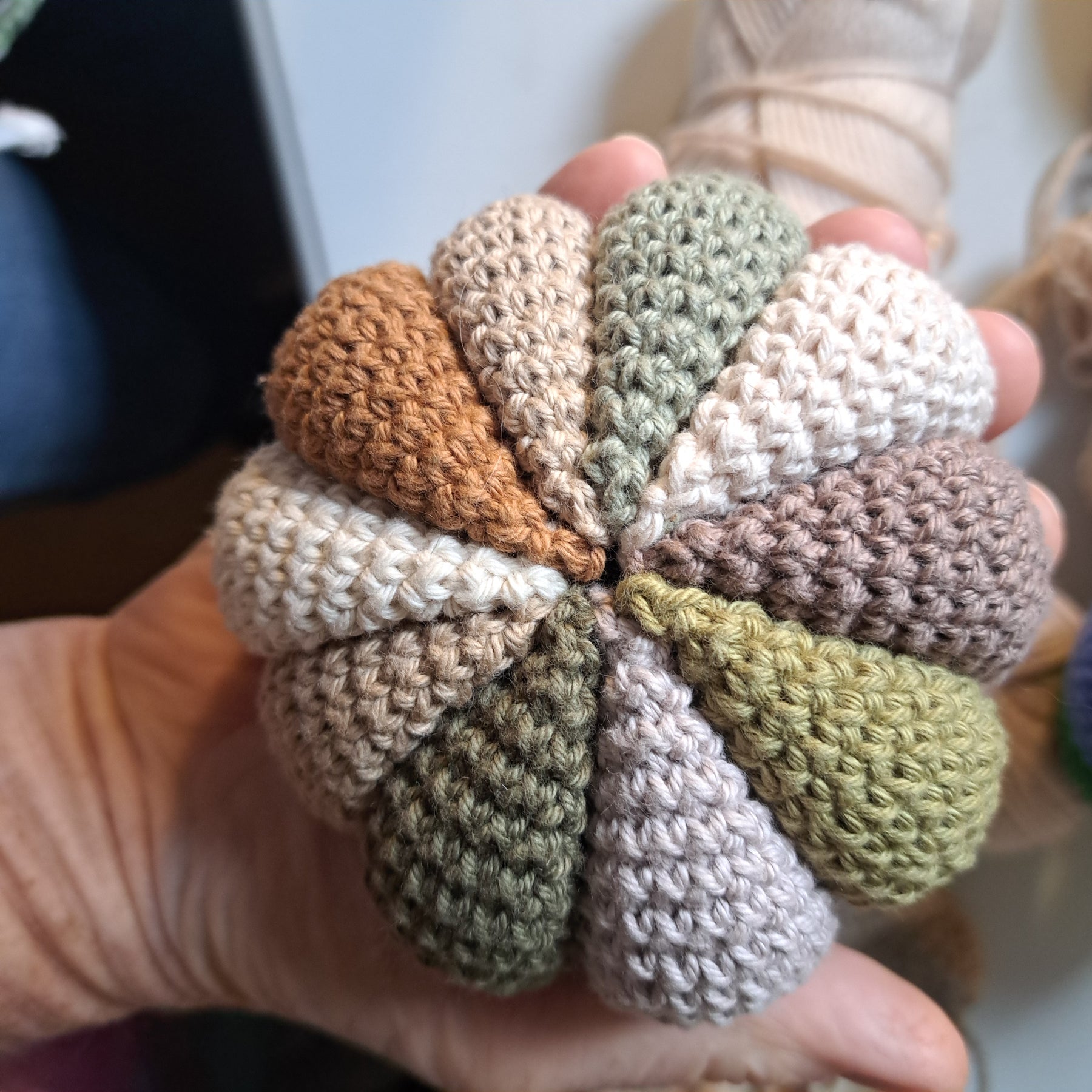 Handmade Crochet sensory ball rattle inside earthy neutral colours