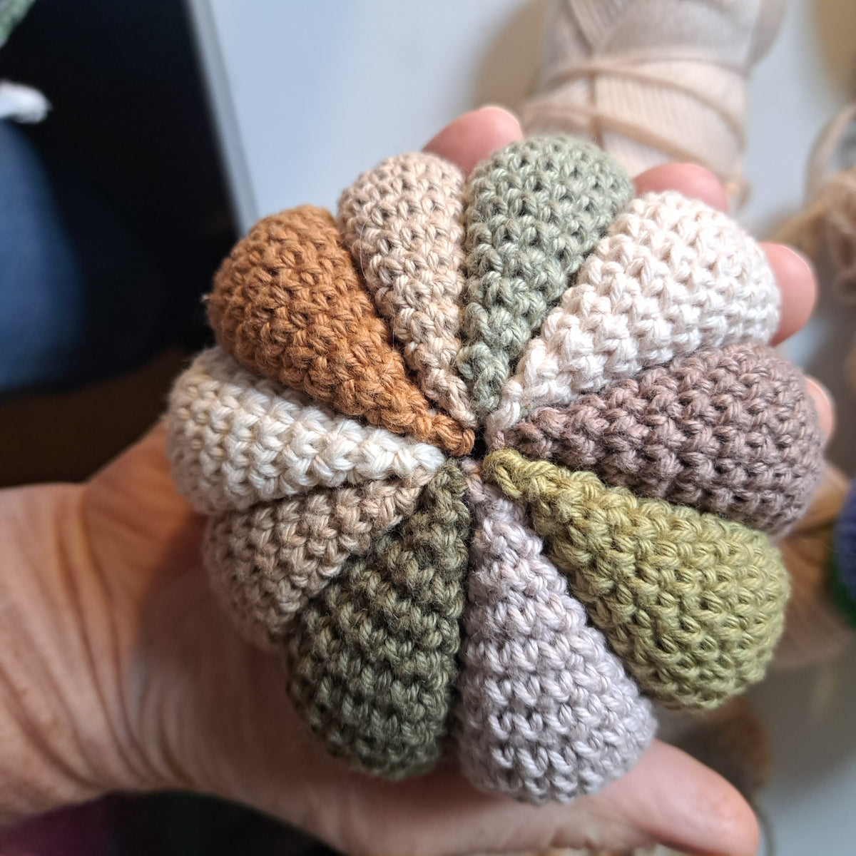 Handmade Crochet sensory ball rattle inside earthy neutral colours