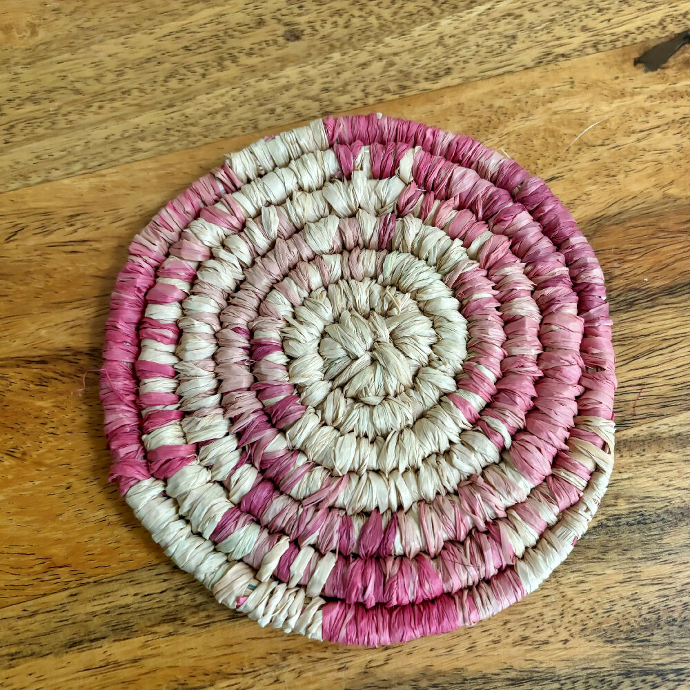 Handcrafted Raffia coasters with pink and red accents