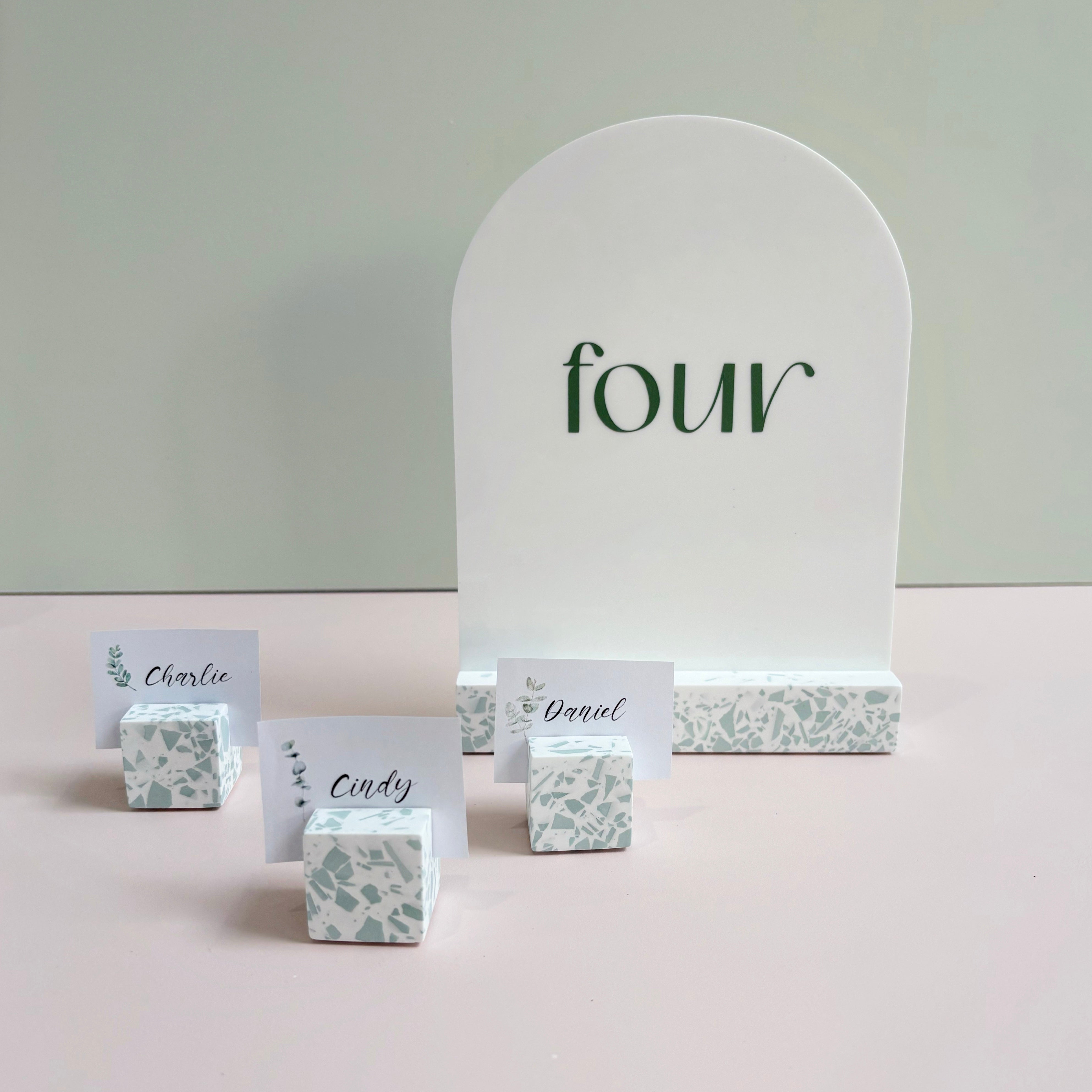 sage green terrazzo event name card holder. photo holder